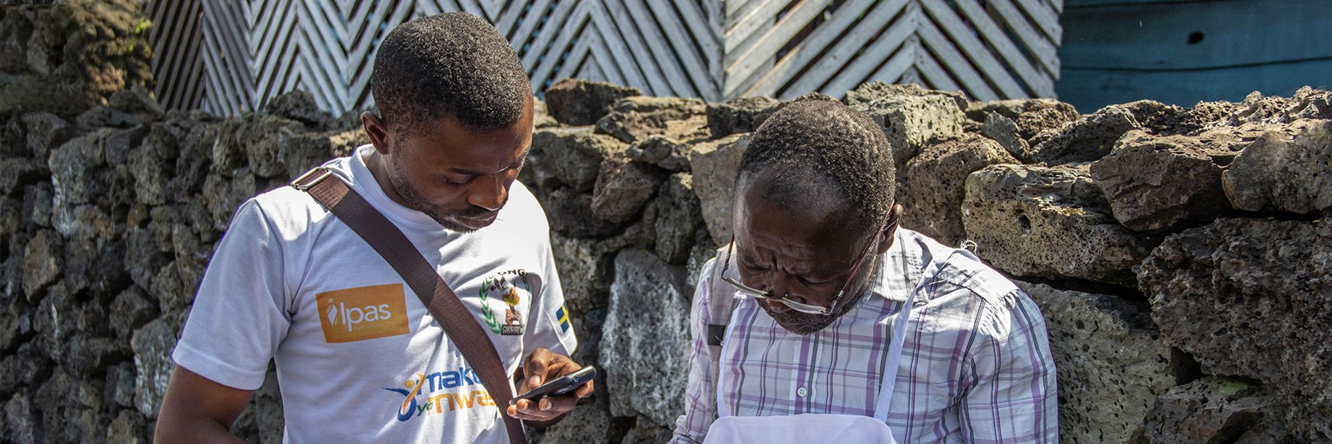 Two people looking at a paper Two people looking at a paper